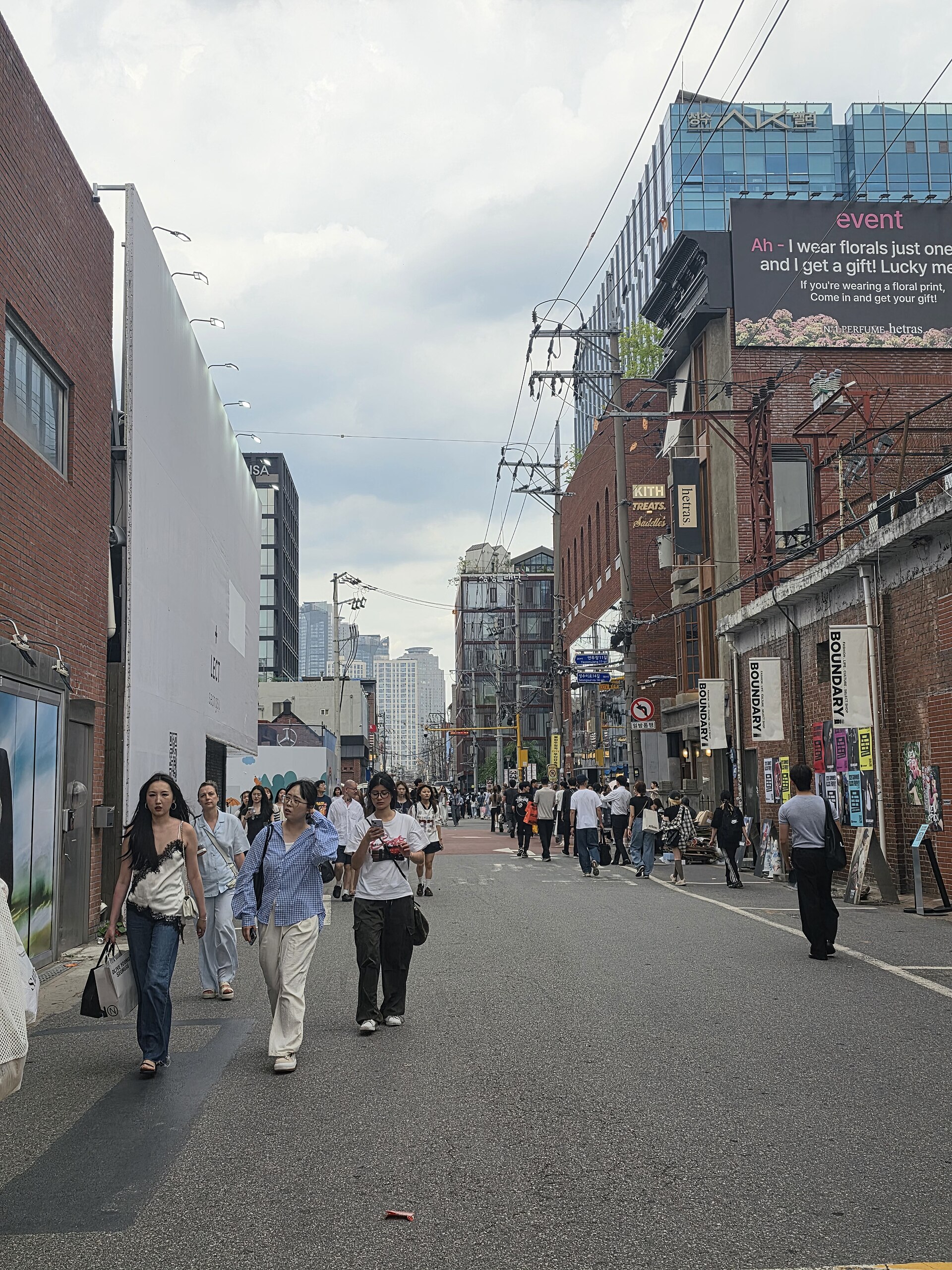 People walking along a Seongsu-dong street in Seoul, independent destination photograph